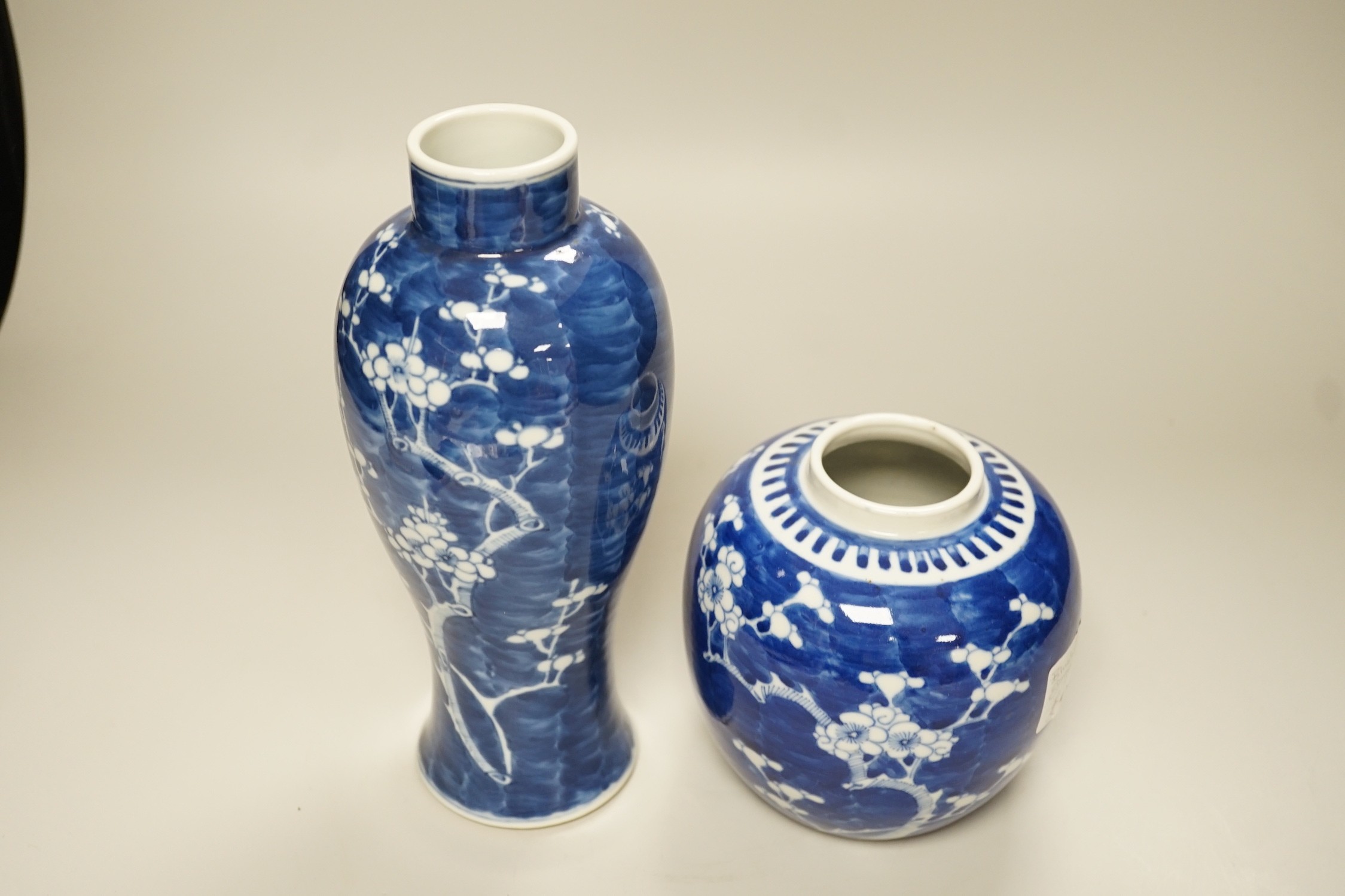 A Chinese blue and white prunus vase and a similar jar, late 19th century, vase 13.5cms high